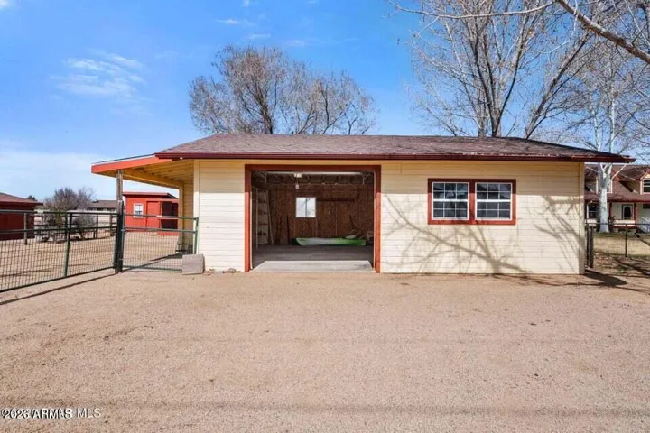 720 Sq Ft, Used as a Shop, with larger roll up door could easily fit 2 cars.