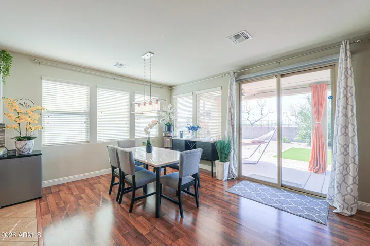 Matching dining table and buffet console convey.