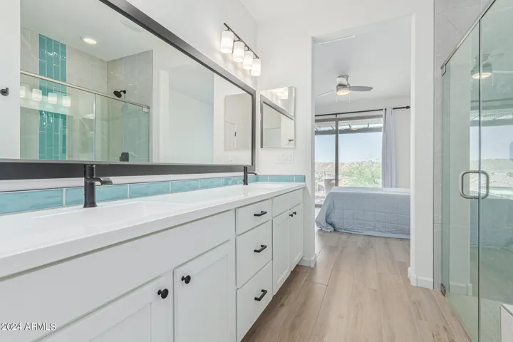 main bathroom, upgraded tile, sinks and countertops