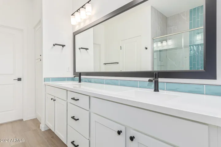 Main Bedroom Bath, double sinks . Upgraded countertops and mirror
