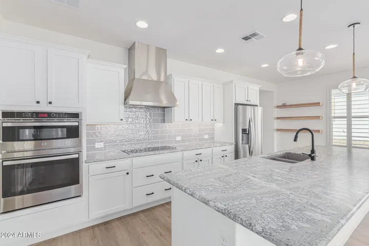 Upgraded kitchen granite counter tops, hood and appliances