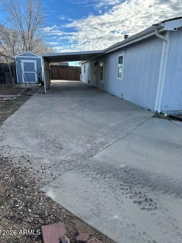 This covered parking in the rear of the property offers convenience and a shaded, clean entry into the home.
