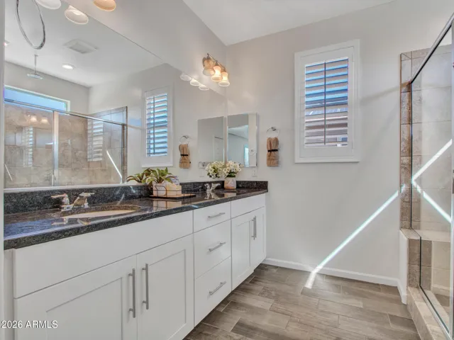 Beautiful Owner's bath with executive height vanity and granite counter tops.