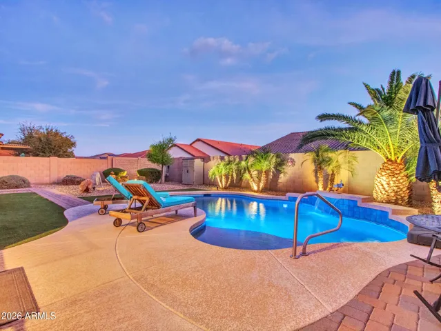Backyard landscaping has Pygmy Palms, faux grass, and rock garden. Low maintenance care, yet gives you a sense of tranquility.