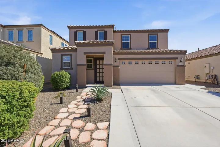 Front exterior, 2 car garage, extended driveway