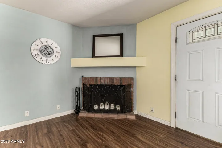 Fireplace in living room off kitchen, backyard door