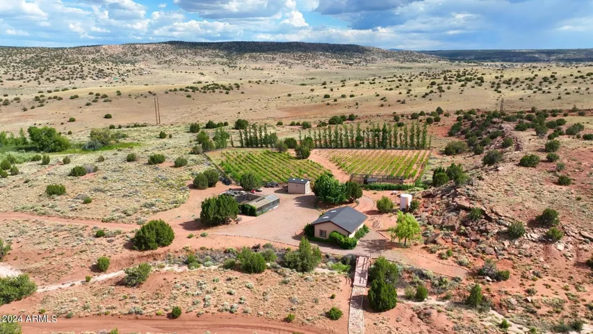 Area for growing vegetables in an enclosed and exposed greenhouse areas, large barn, lots of enclosed storage, potting barn, possibilities are endless of what you can do!