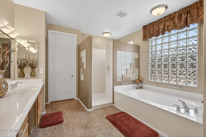 Soak or shower in the owner's bath with walk-in shower.