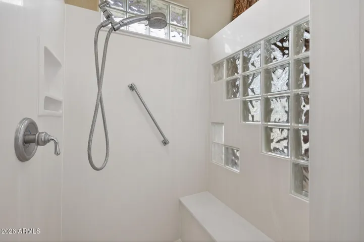 Cultured marble surrounds you in luxury in the large shower.