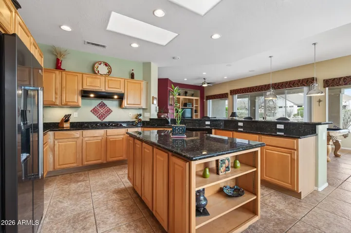 The island offers the perfect spot for meal prep or serving guests.