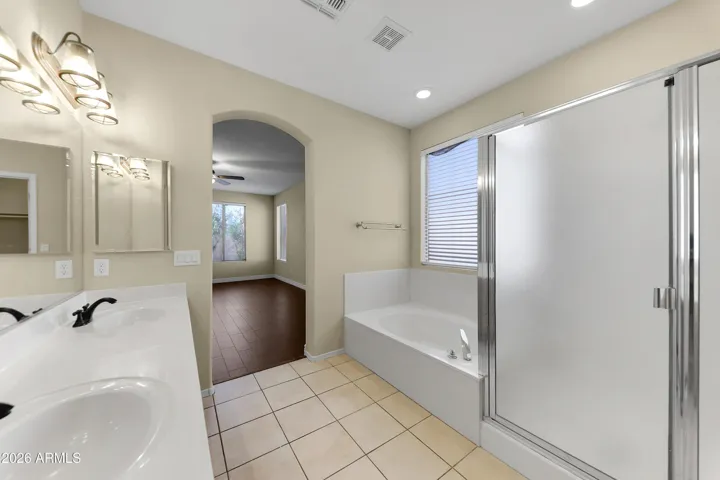 Master Bath & separate tub and shower and separate toilet room.
