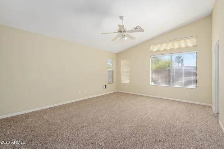 Soaring ceiling, natural light, and ceiling fan make this your personal sanctuary