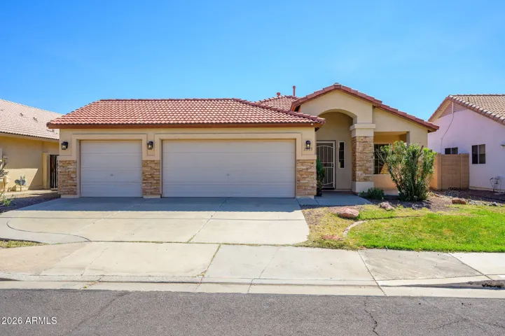 Front of Home features a 3 car garage and stone trim for added elegance
