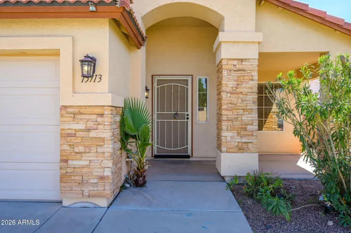 Front of home with stone trim