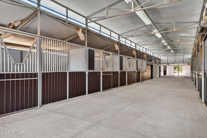 main show barn with 21 stalls, office, 4 wash racks and two tack rooms