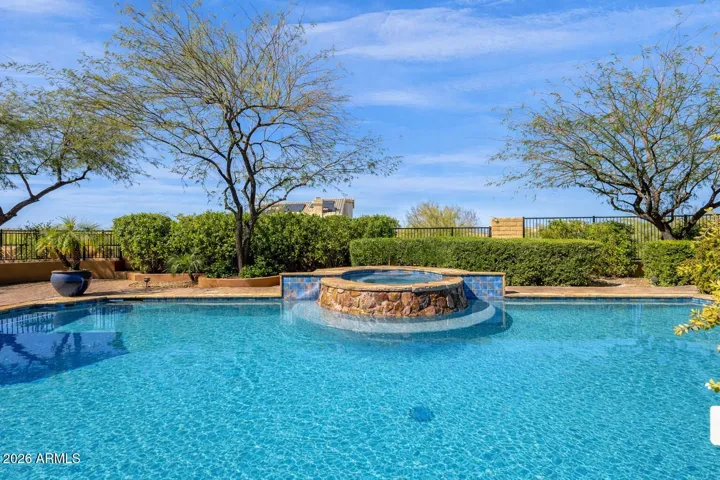 Resort style pool includes a water feature, purely for enjoyment...not to hide or block noise.