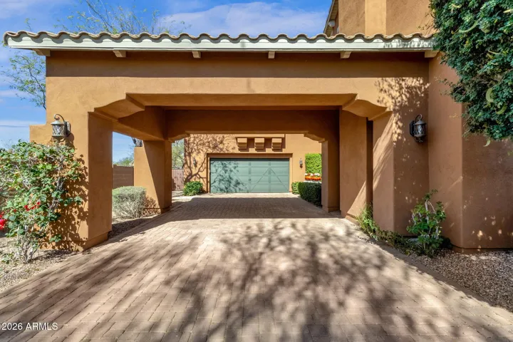 Port-Cochere provides shade and access to the home through the courtyard, be it dropping groceries or picking up kiddos, so convenient!