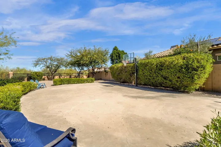 Sport court and hoop, perfect surface for roller skates, skateboards and tricycles.