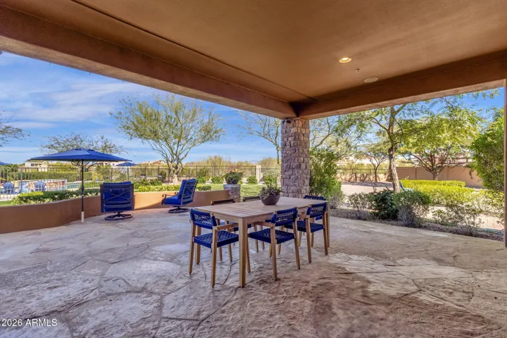 Covered patio with direct access to kitchen is quite large, shown with seating for six but plenty of room to accommodate many more.