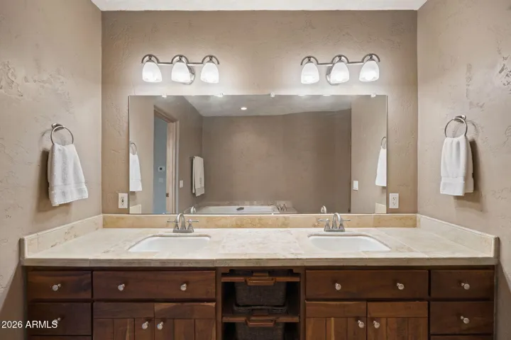 Primary bath with dual vanities, extended counter space, and abundant storage.