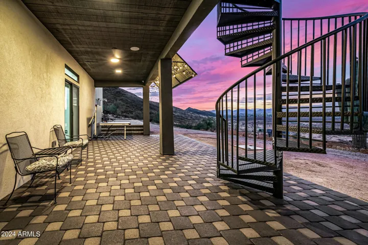 Spiral staircase leading to main floor patio and master patio.