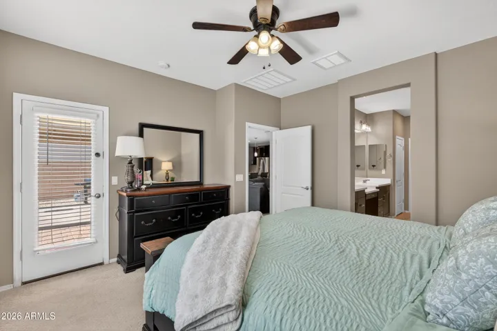 Downstairs Primary Bedroom Measures 14'x14'3" and has an Exit Door that leads to the Patio.