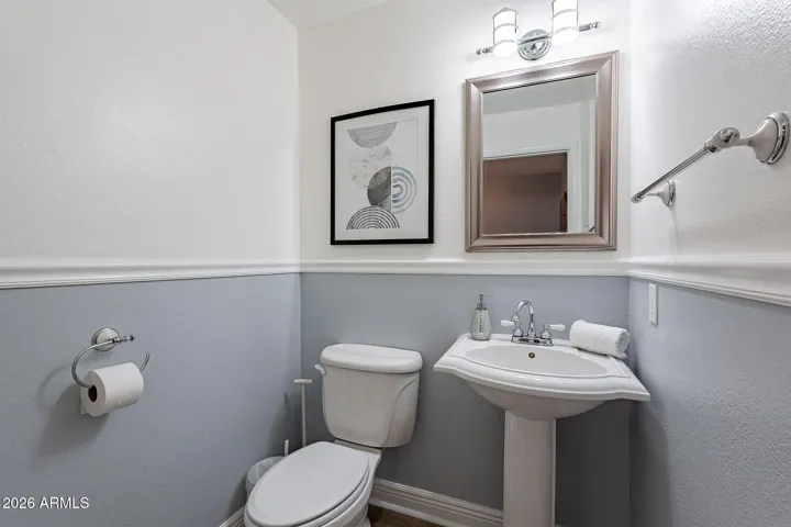 Convenient powder room located off the entry