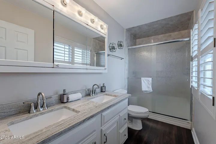 Primary includes dual sinks and walk-in shower