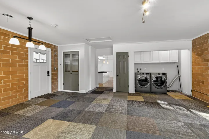 Additional entry from carport and space for washer/dryer