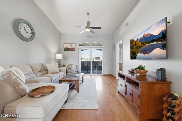 Open living area with sliding doors leading to the private balcony