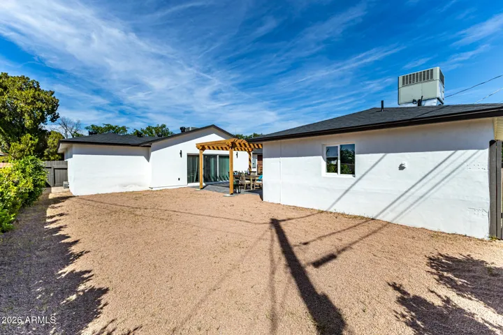 Backyard with paver casita and ramada