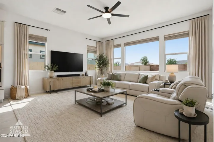 Bright, open living room with large windows and abundant natural light