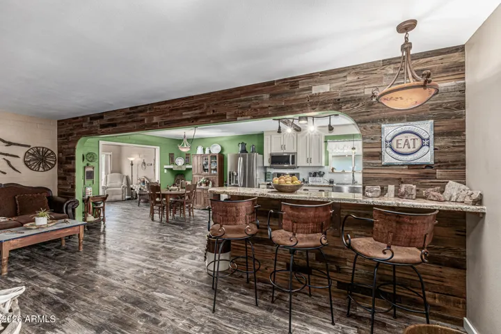 LOOK AT THAT OPEN KITCHEN! THE ORIGINAL WALL WAS REMOVED TO CREATE A BEAUTIFUL FLOW!