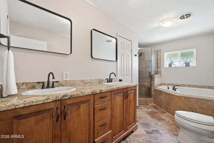 Full bathroom with soaking tub and walk-in shower