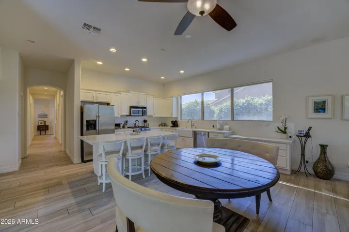 Kitchen with quartz island and gas range