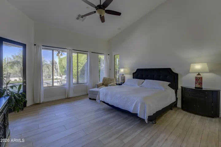 Primary suite exits to backyard.