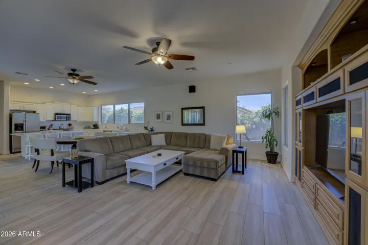 Great room featuring large windows.