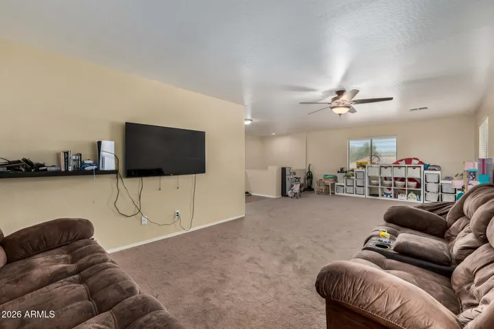 Large upstairs loft offering endless possibilities for a second living area, office, or entertainment space.