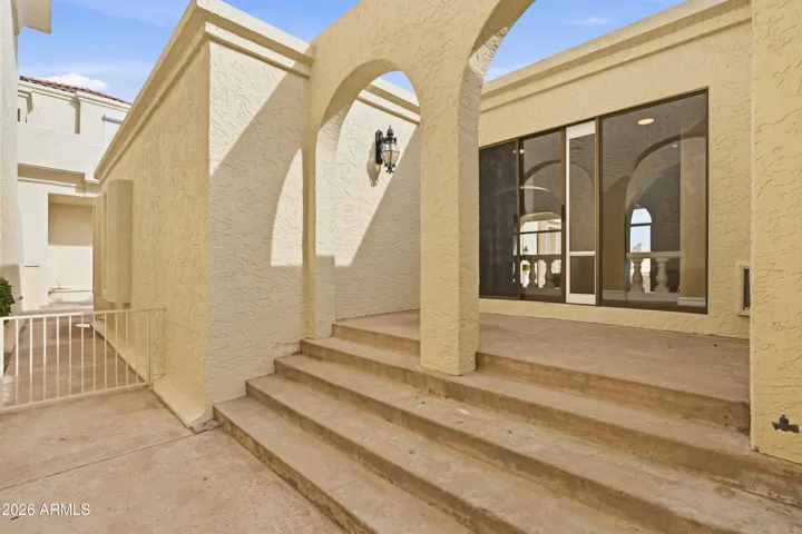Secluded patio space with classic Mediterranean-style arches.