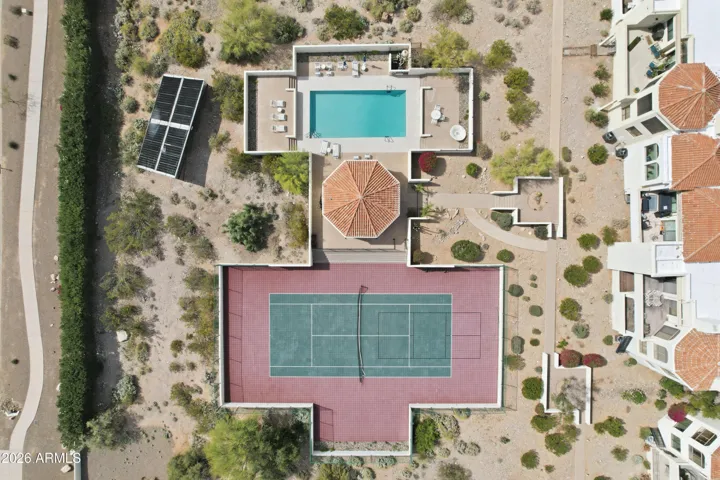 Resort-style community amenities including a heated pool, tennis court, and cabana