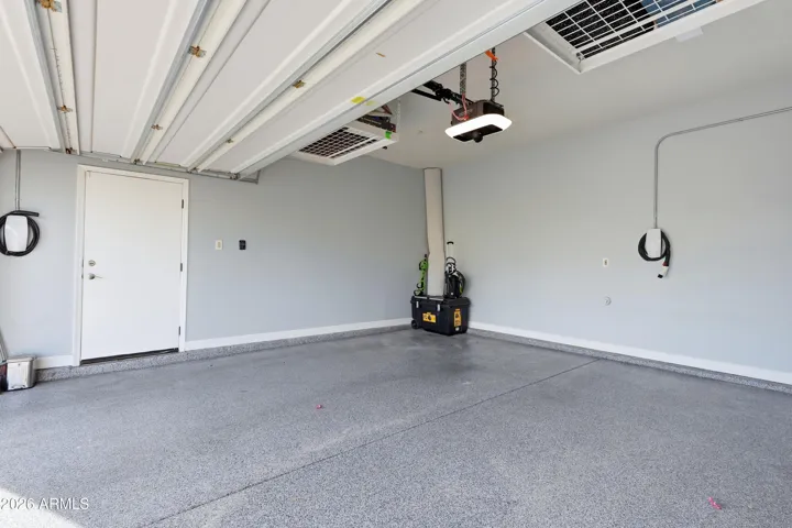 Finished garage with epoxy flooring and two EV charging stations