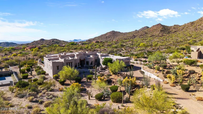Private drive winds through a lovely cactus garden.