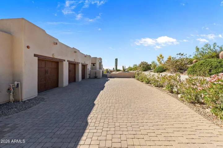 Garage entrances at the side of the home.