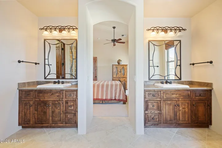 Junior suite bathroom with tub, shower, twin vanities and large walk-in closet.