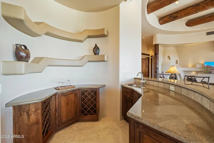 Wet-bar with beverage fridge & ice maker.