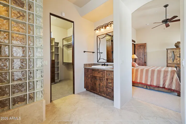 Junior suite bathroom with tub, shower, twin vanities and large walk-in closet.
