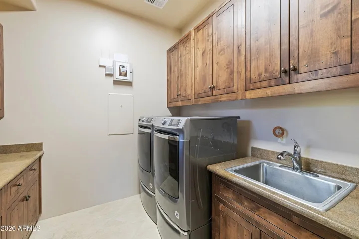 Spacious laundry room includes appliances.