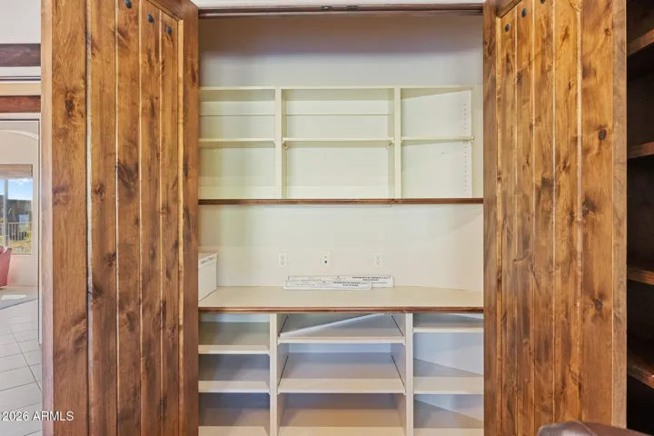 Closet in 4th bedroom, currently configured for office use.