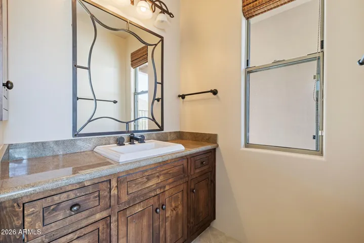 Junior suite bathroom with tub, shower, twin vanities and large walk-in closet.
