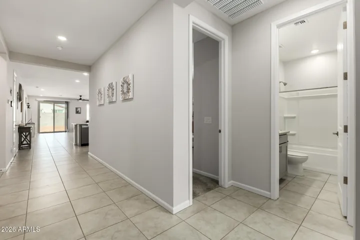 Entry to home - looking at bedroom 3 and full hall bath